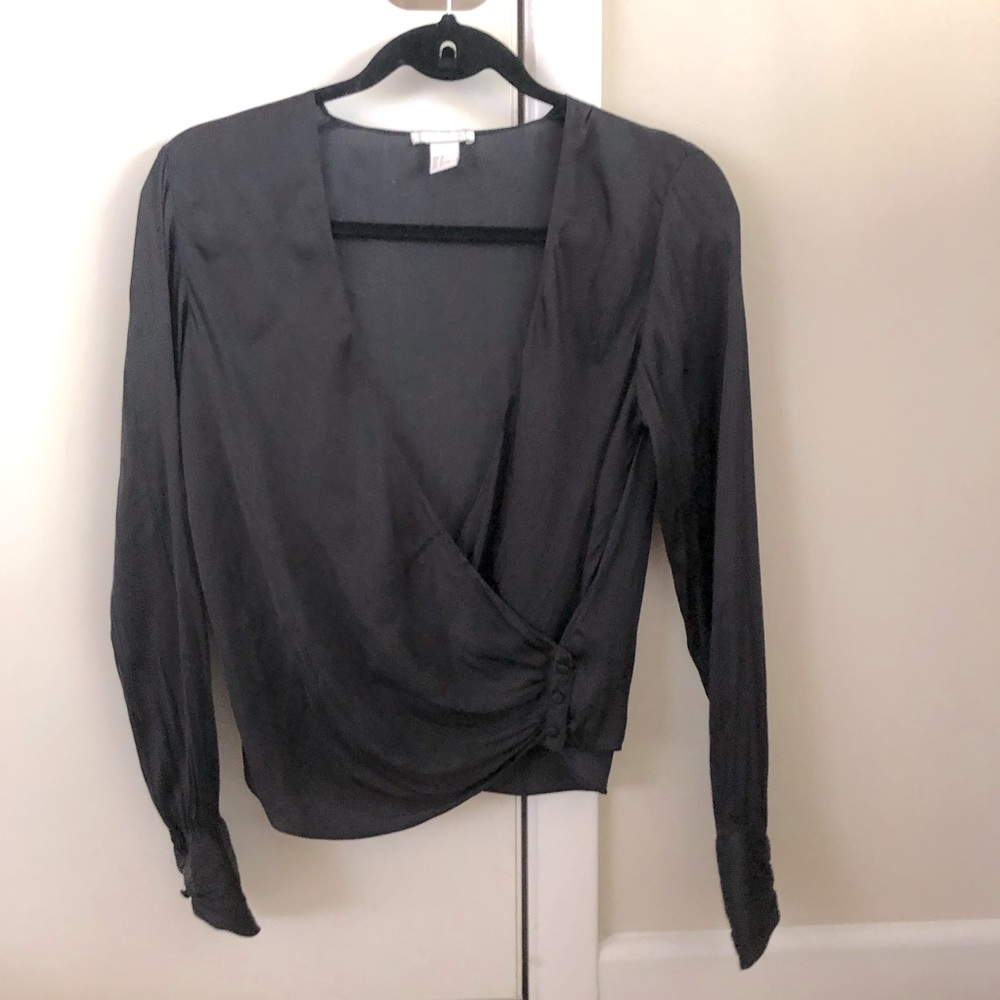 H&M black wrapped blouse with button detail.